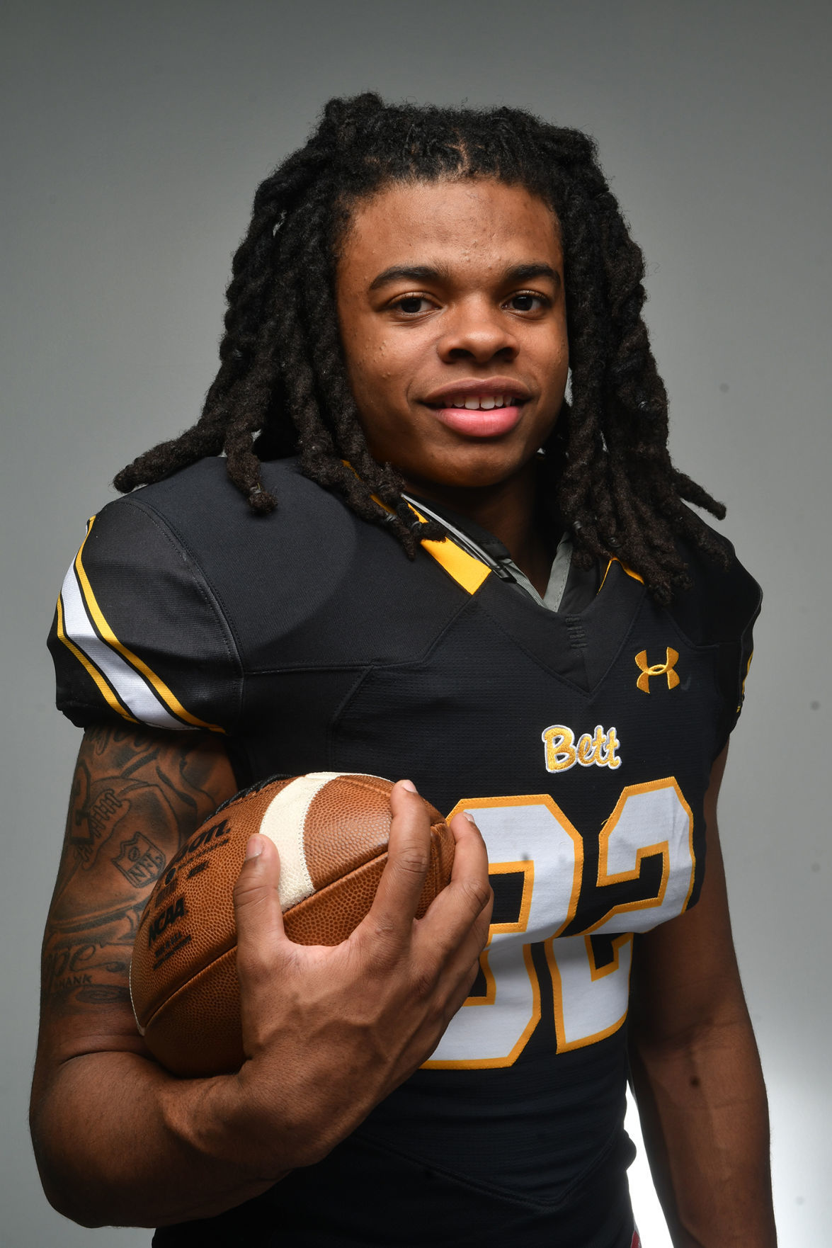All-Metro football captains Bettendorf's Harrison Bey-Buie and Assumption's Seth Adrian.